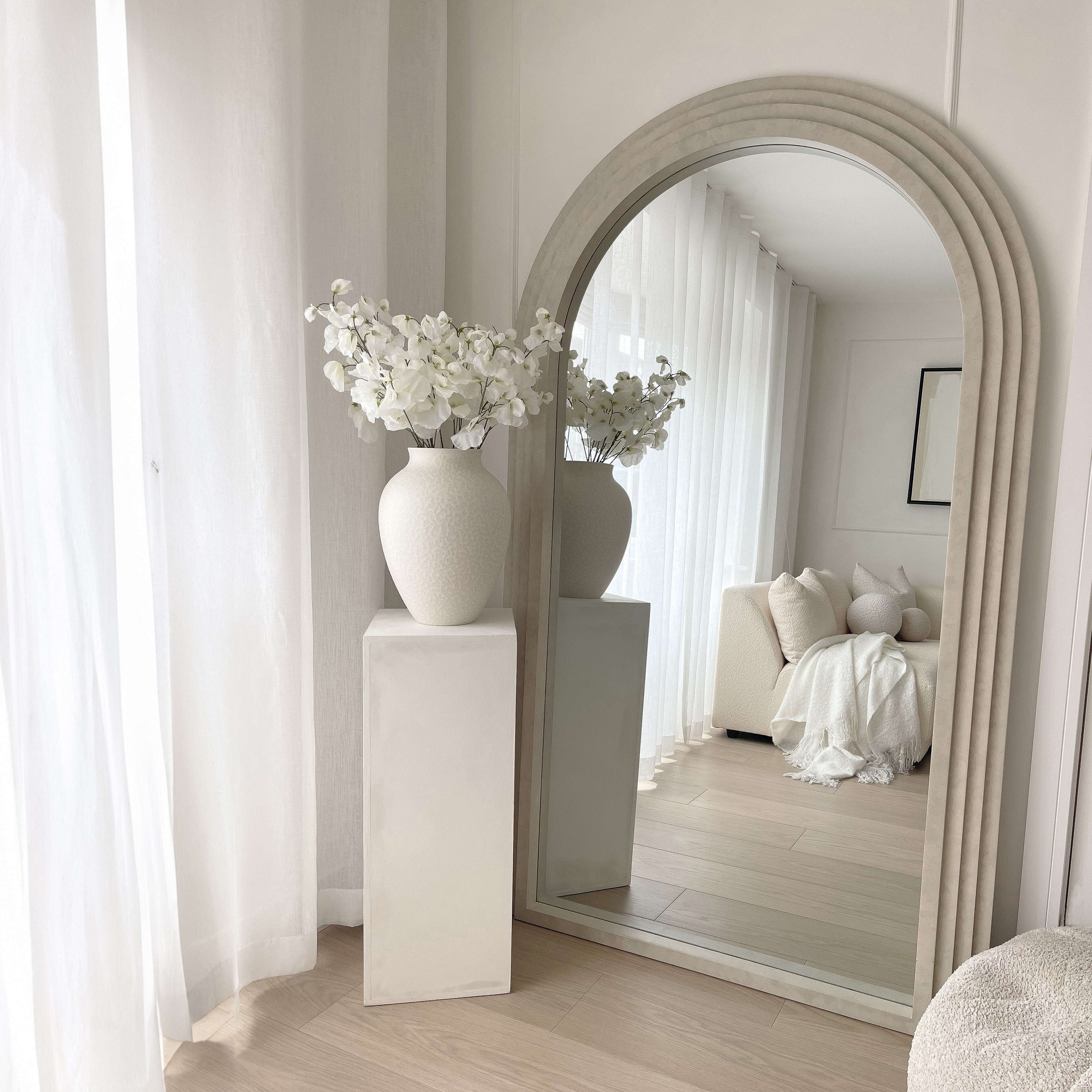Hero — ambient video or photo · full-length mirror in a sunlit room